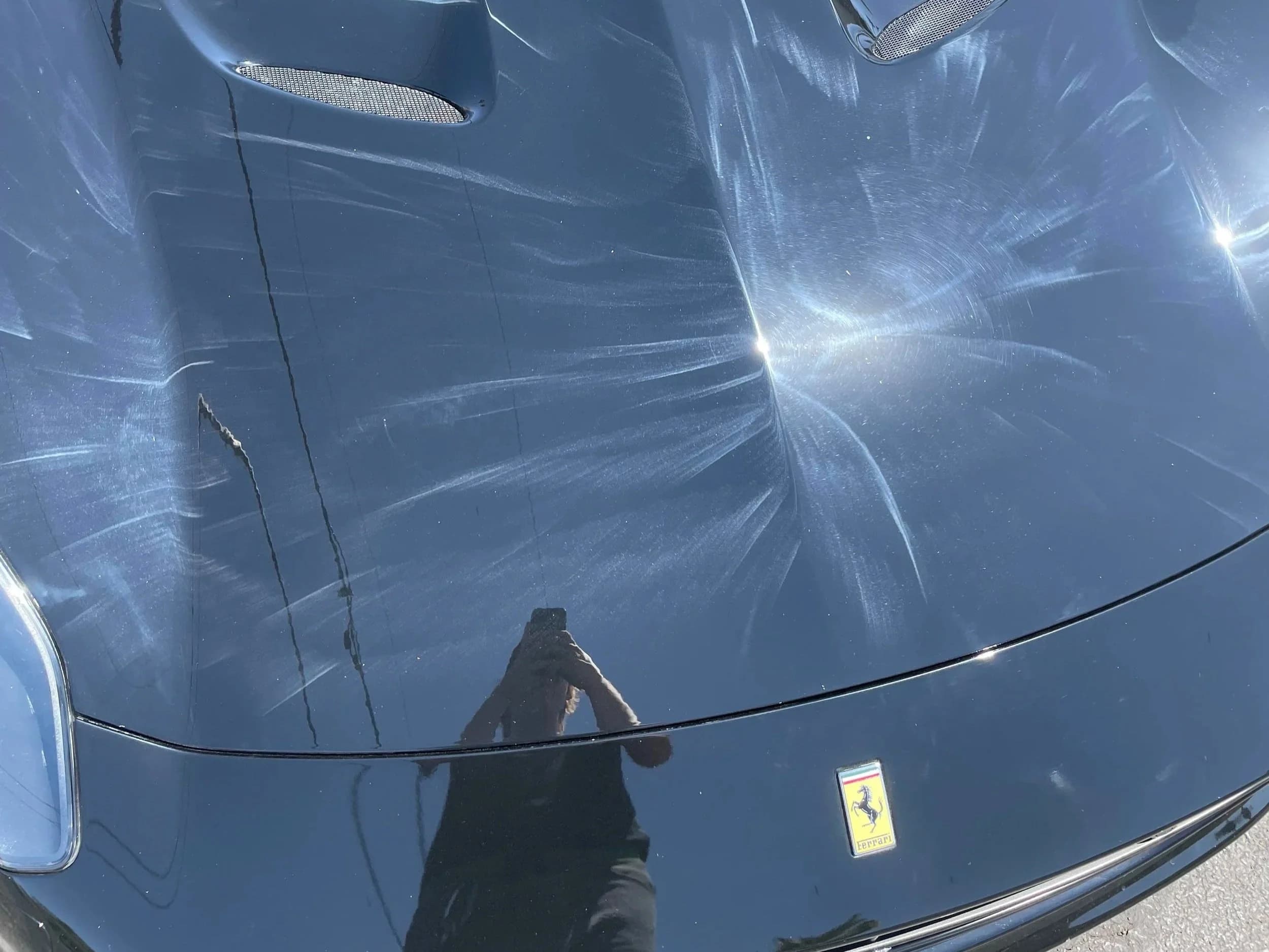 Swirl marks on car paint before correction